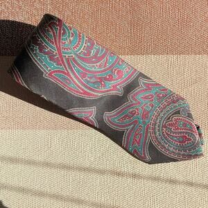 Mario Valentino Italian silk tie. Wonderful colors, paisley swirls. Made in USA